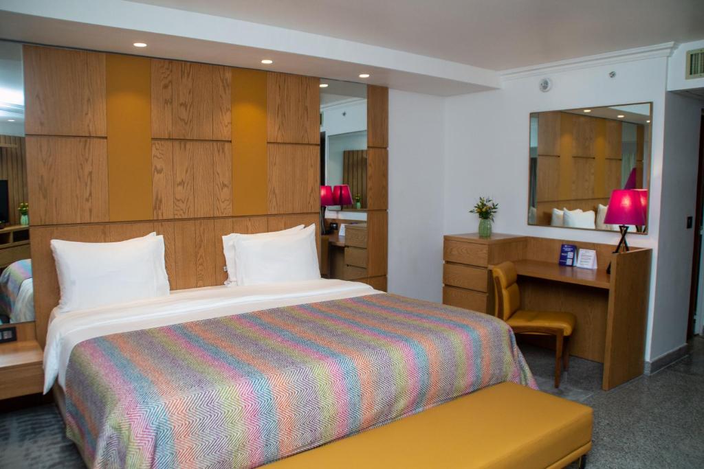 Postel nebo postele na pokoji v ubytování Eko Hotel Main Building