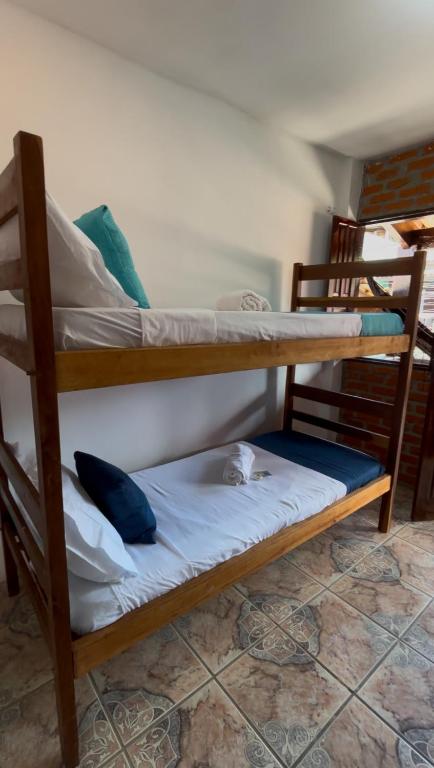 Postel nebo postele na pokoji v ubytování Cacau Biruta