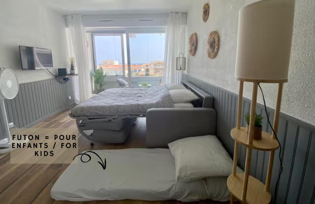 Postel nebo postele na pokoji v ubytování *Les Voiliers, Studio, Vue sur Mer, Wifi, Parking*