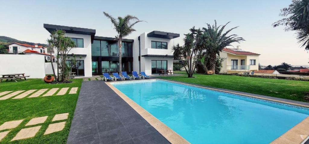an image of a house with a swimming pool at Exceptional villa in Vila Franca Do Campo with private pool in Vila Franca do Campo