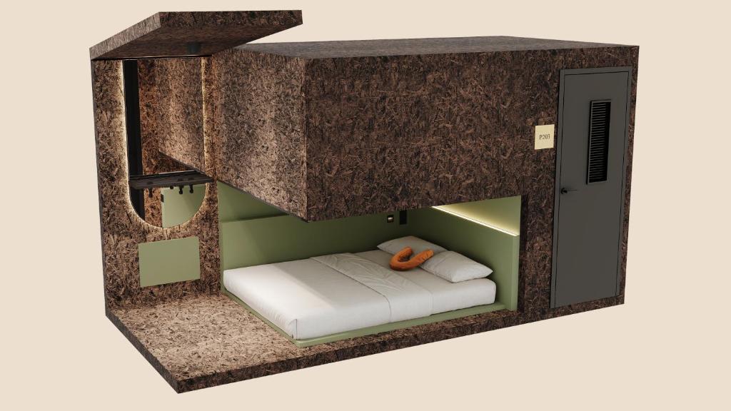 Una cama o camas en una habitación de Pods by The Usual Rotterdam