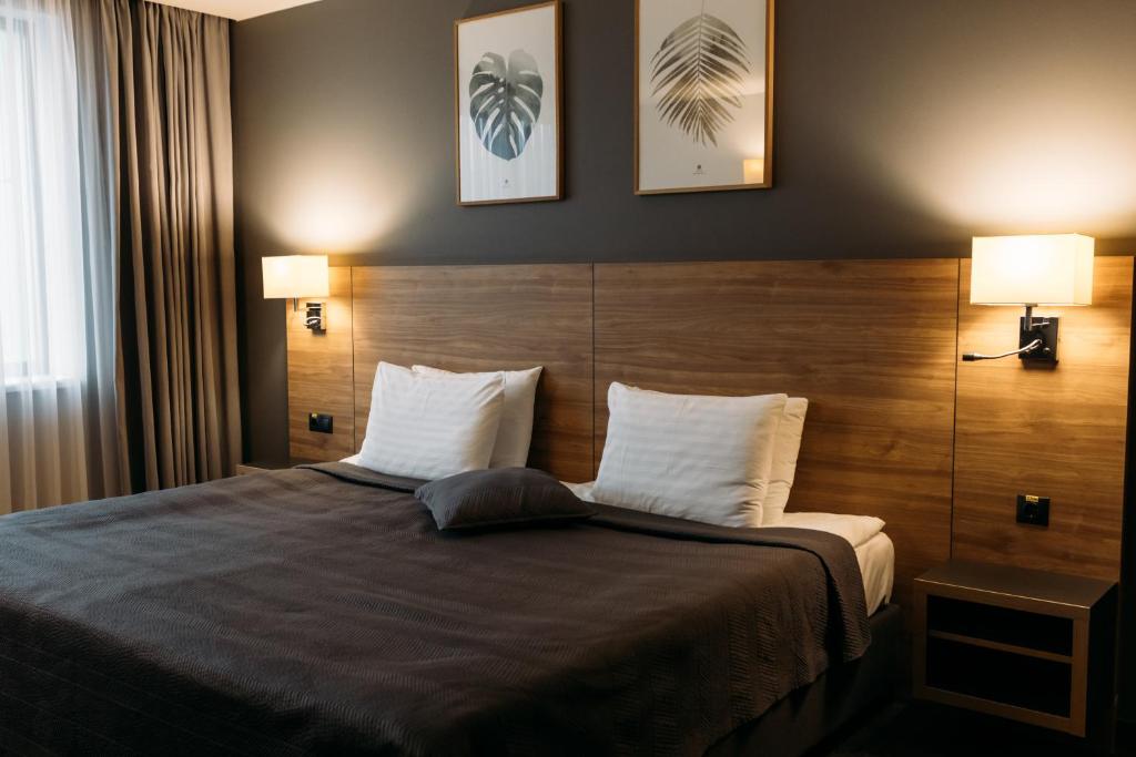 Postel nebo postele na pokoji v ubytování Favor Park Hotel