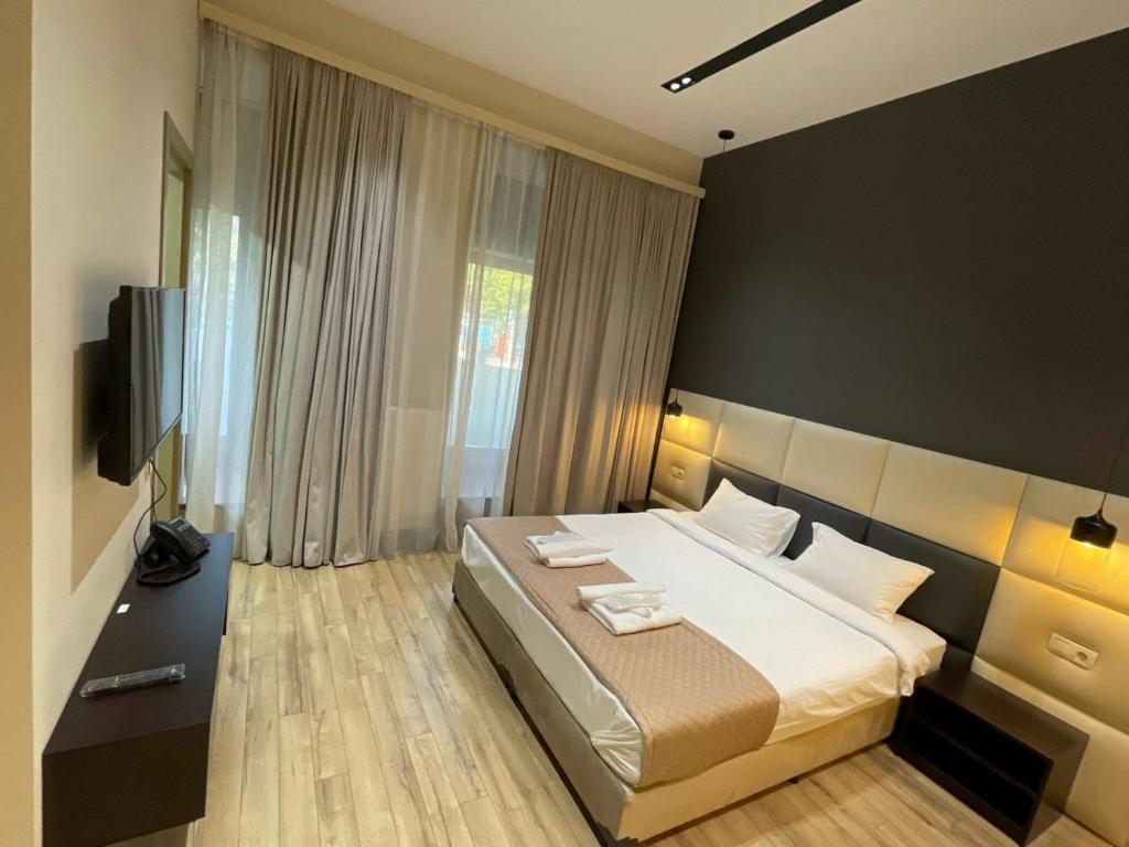 Postel nebo postele na pokoji v ubytování History Hotel Tbilisi