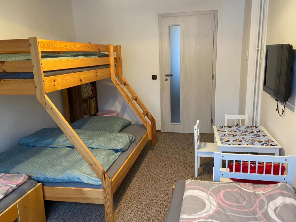 Postel nebo postele na pokoji v ubytování Apartmán Orlické hory