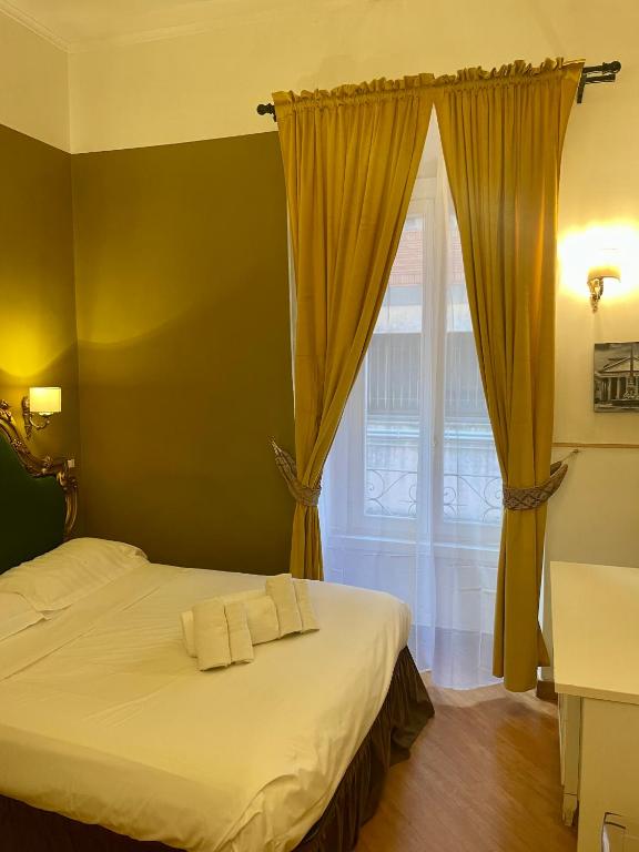 Postel nebo postele na pokoji v ubytování DCBoutiqueHotel