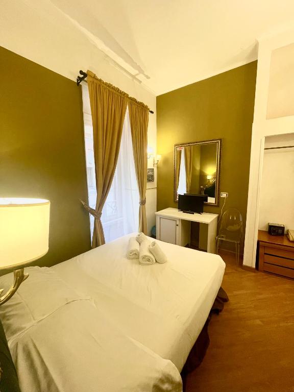 Postel nebo postele na pokoji v ubytování DCBoutiqueHotel