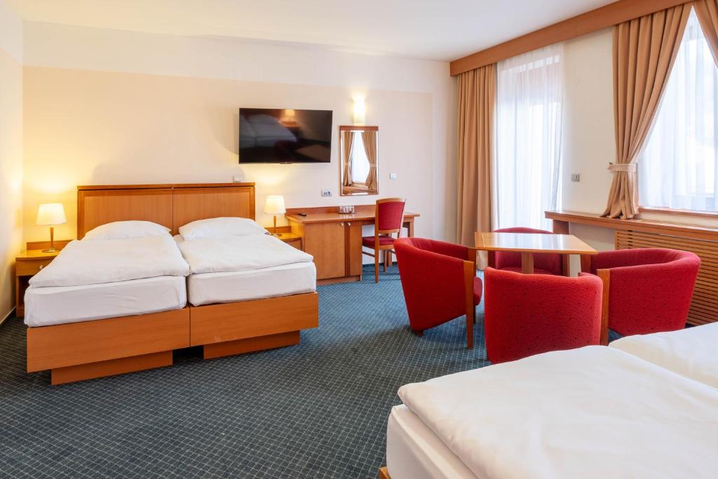 Postel nebo postele na pokoji v ubytování Hotel Slovan