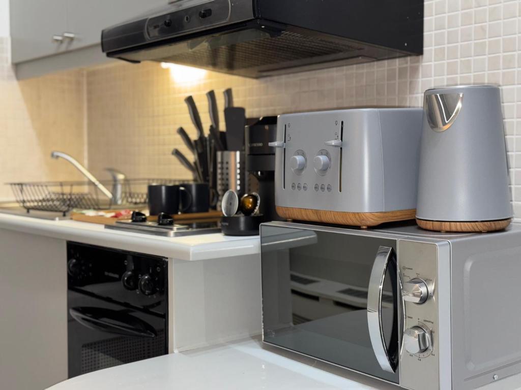 a kitchen with a counter with a appliance on it at Central Studios Near Hyde Park in London