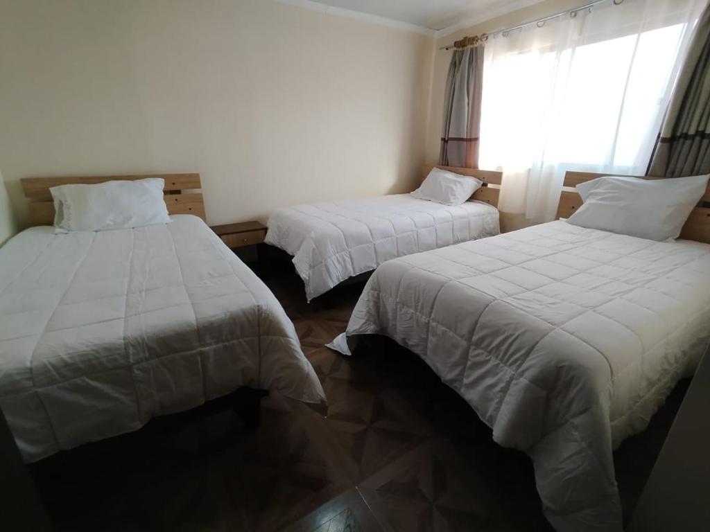 Ένα ή περισσότερα κρεβάτια σε δωμάτιο στο Hotel Victoria