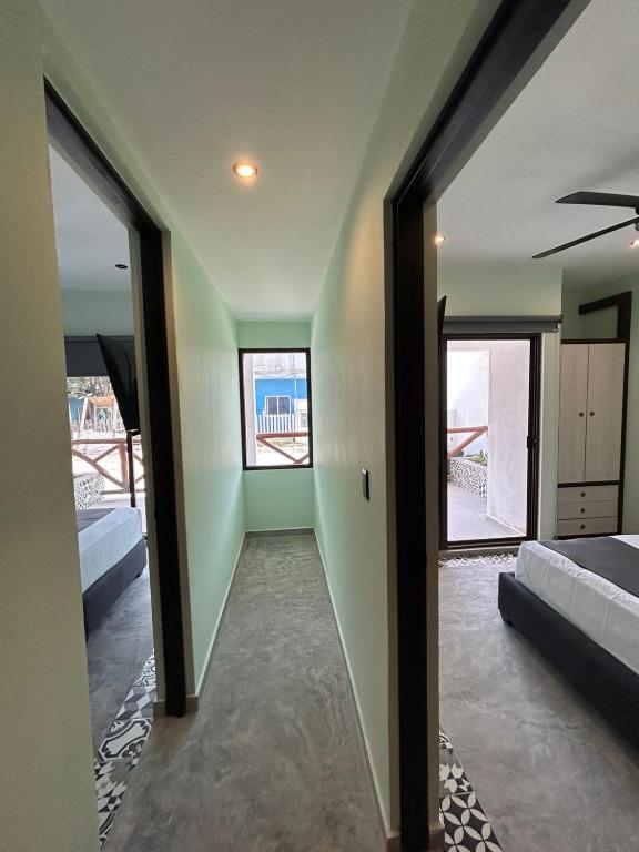 Postel nebo postele na pokoji v ubytování Hotel Mariel Holbox