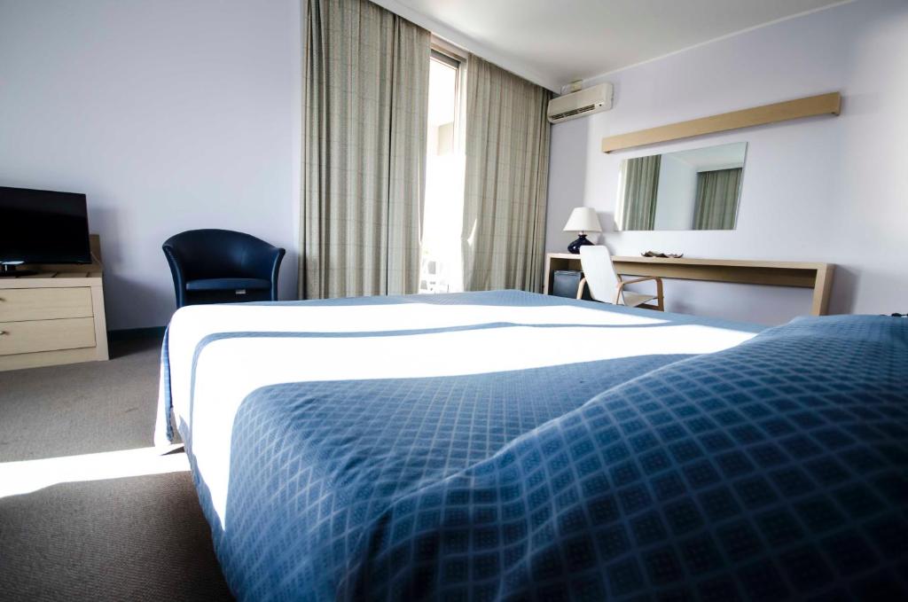 Postel nebo postele na pokoji v ubytování Grand Hotel Helios
