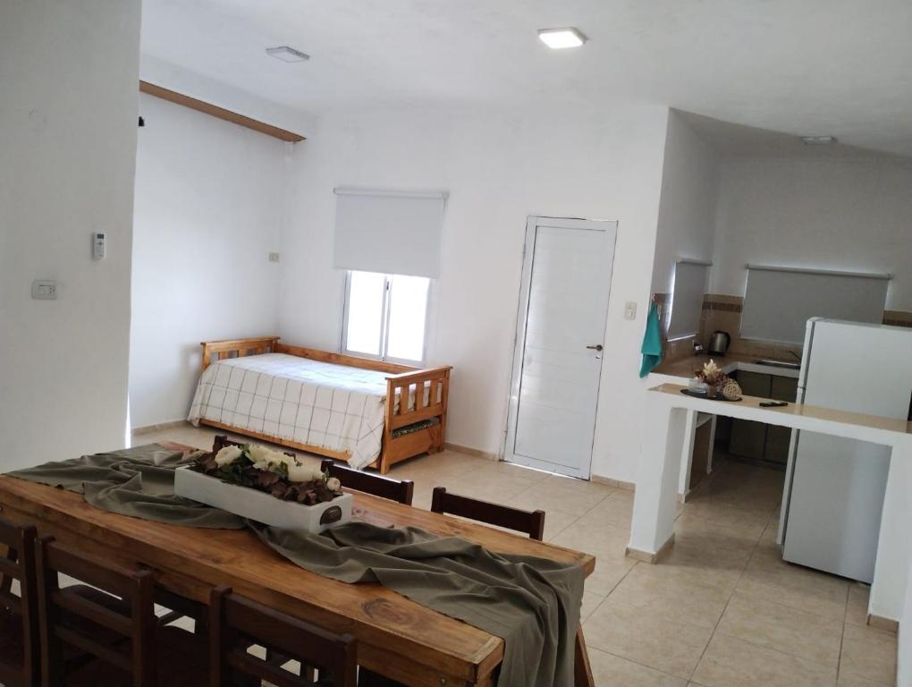 a room with a table and a bed in it at Casa Poetas in Villa Nueva