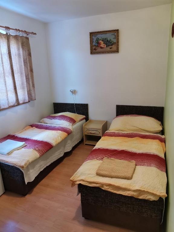 Postel nebo postele na pokoji v ubytování Penzion sklípek Mušov