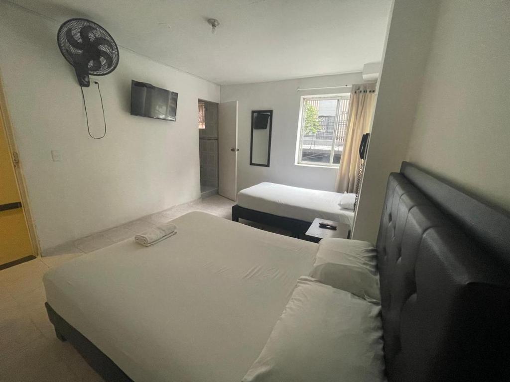 Postel nebo postele na pokoji v ubytování Hotel Villa Real