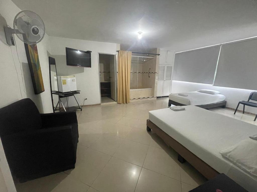 Postel nebo postele na pokoji v ubytování Hotel Villa Real