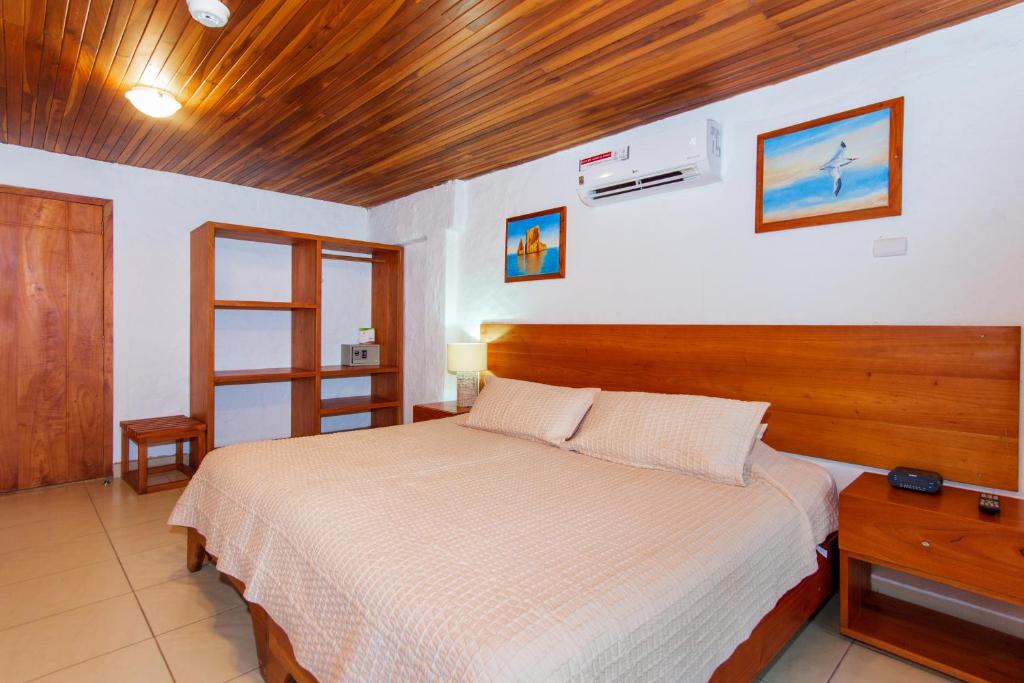 Postel nebo postele na pokoji v ubytování Hotel Fiesta