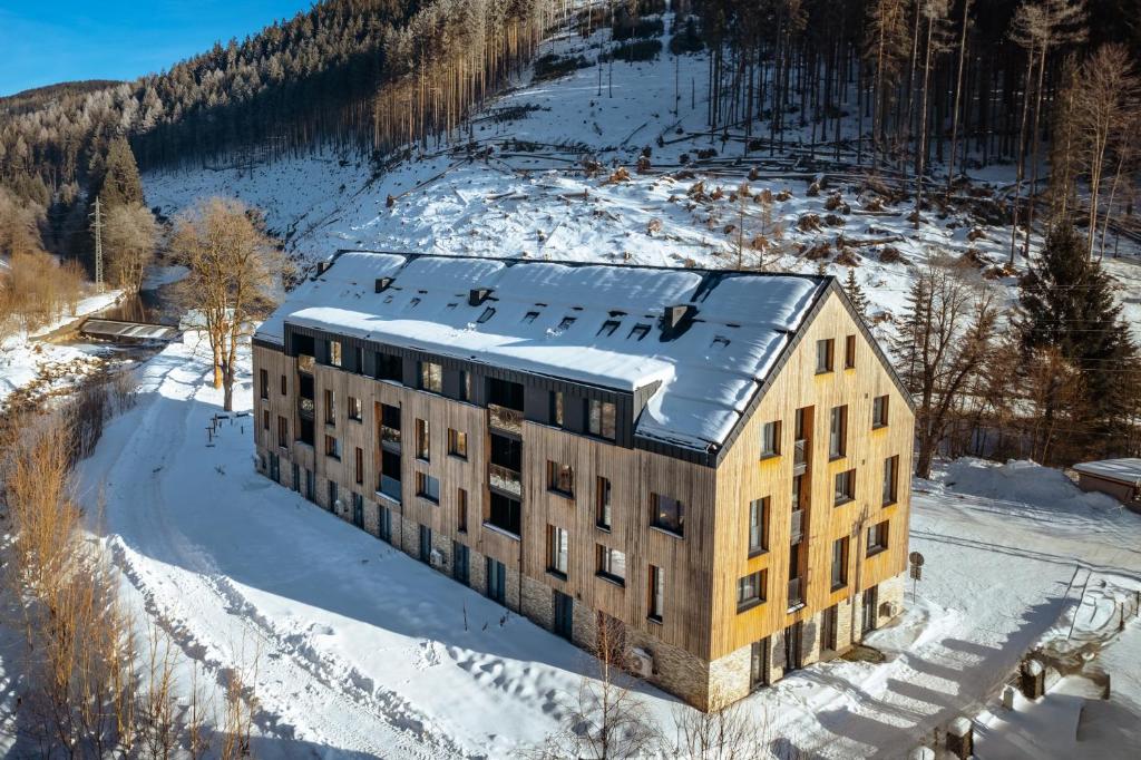 an aerial view of a building in the snow at Mlýn Herlíkovice in Hořejší Vrchlabí