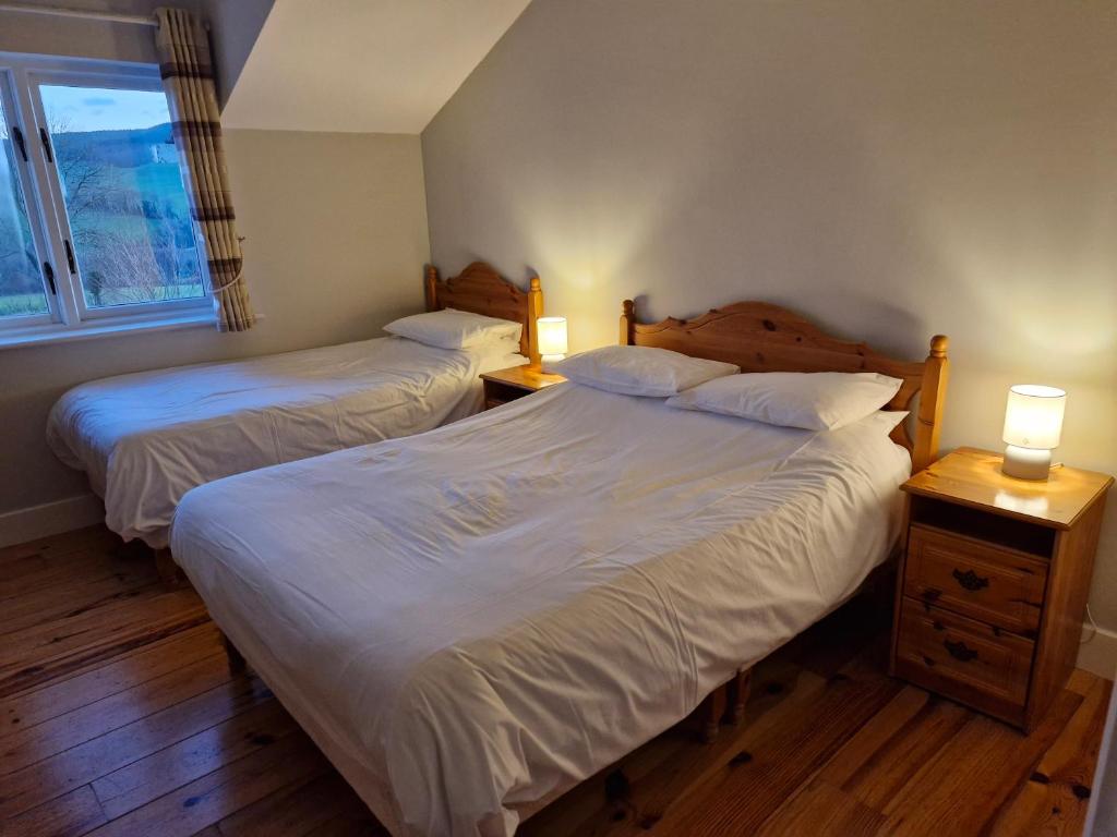 Postel nebo postele na pokoji v ubytování Macreddin Rock Bed & Breakfast