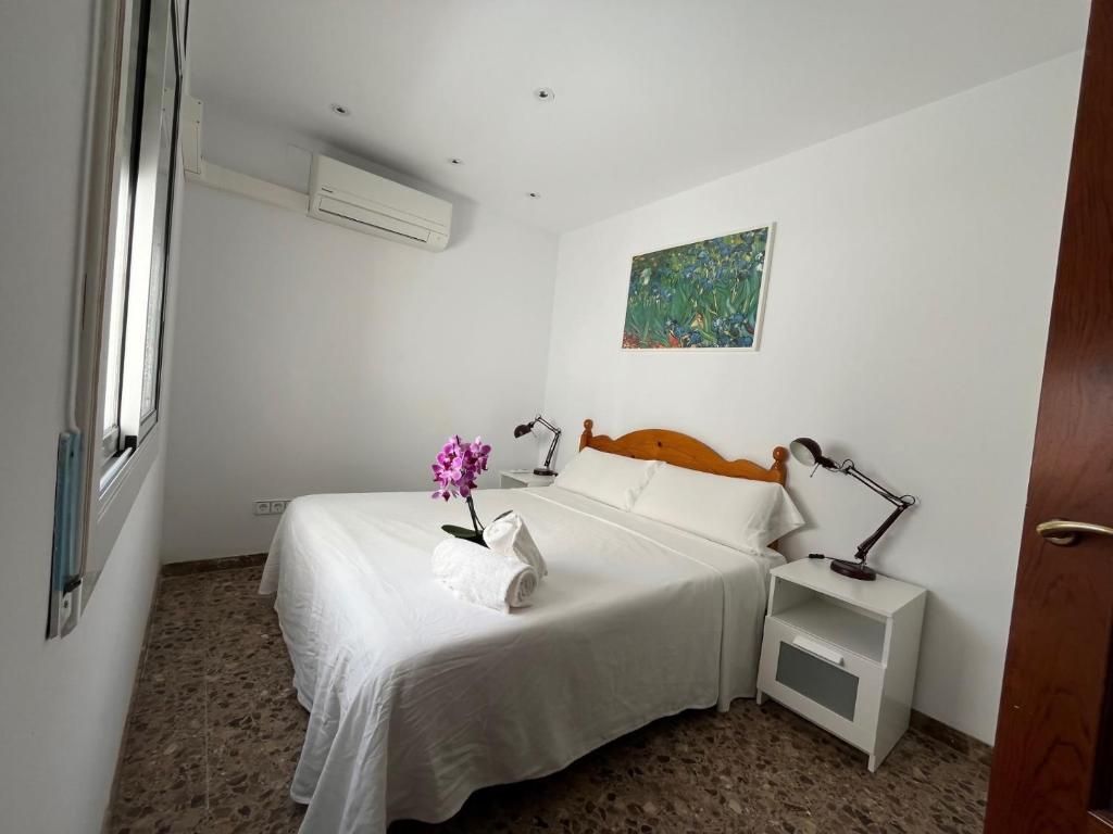 En eller flere senge i et værelse på Zen mar Confort & Relax centro Calafell