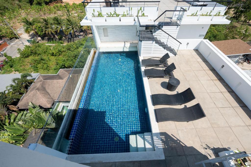 an overhead view of a swimming pool on a building at Yenna Apartment in Kamala Beach