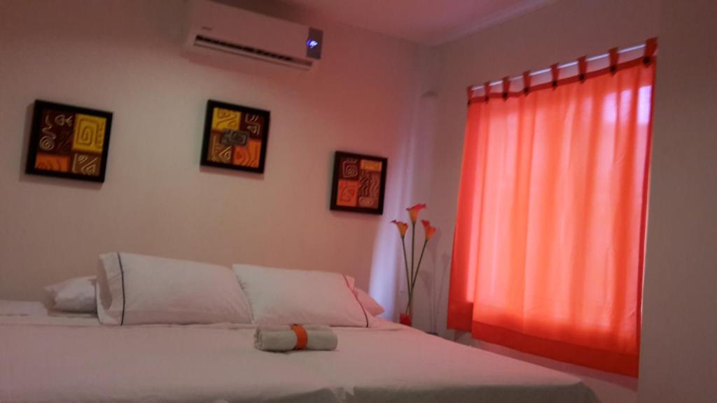 Postel nebo postele na pokoji v ubytování Manzanillo Beach
