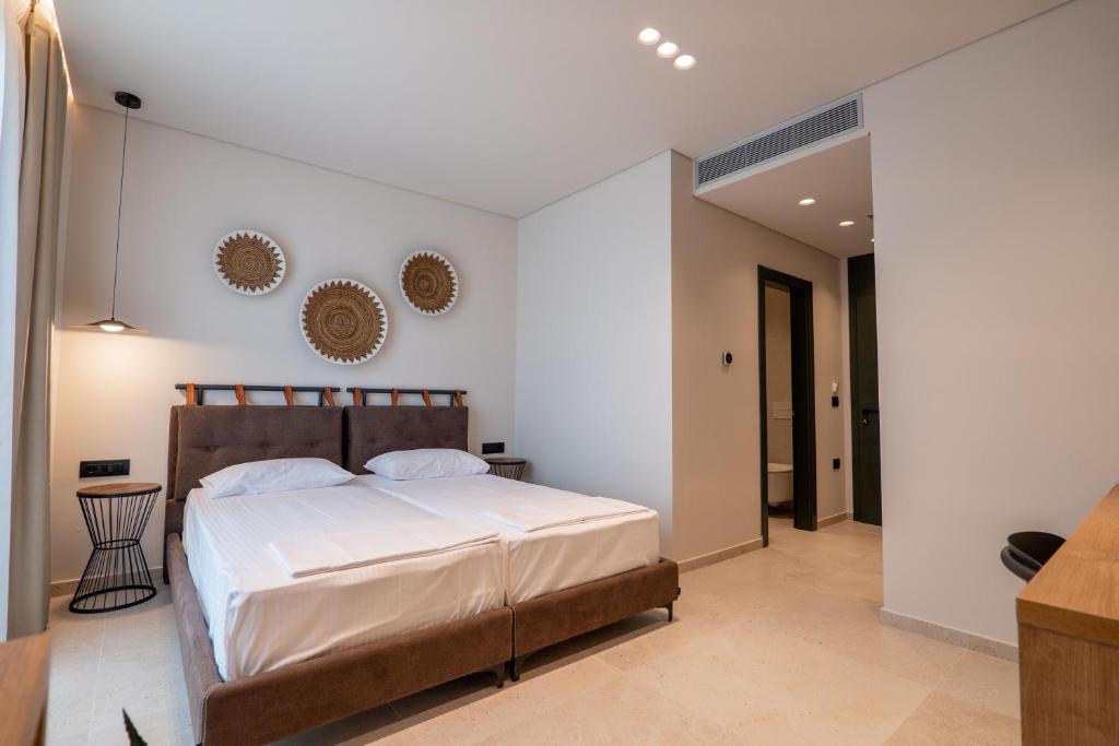 Postel nebo postele na pokoji v ubytování Kamara Rooms