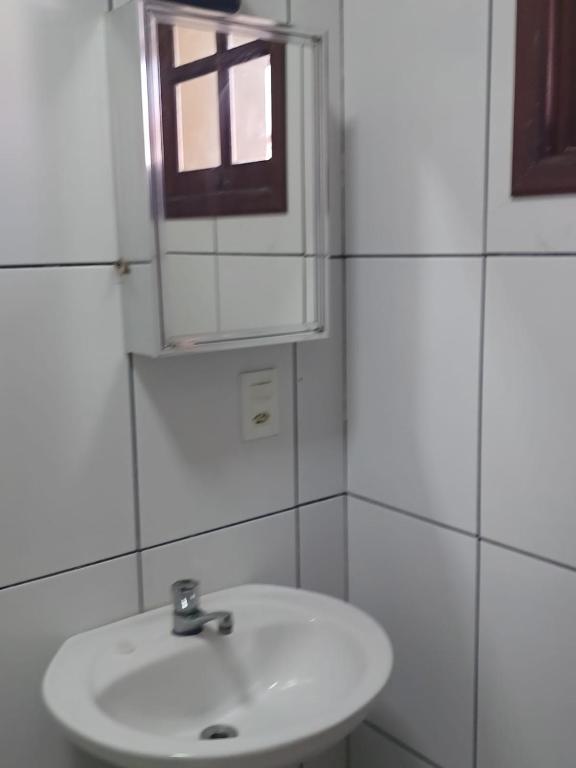 Um banheiro em Casa Centro Piscina