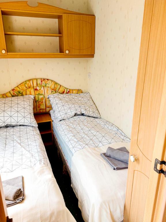 Postel nebo postele na pokoji v ubytování Domek holenderski Sosnowa