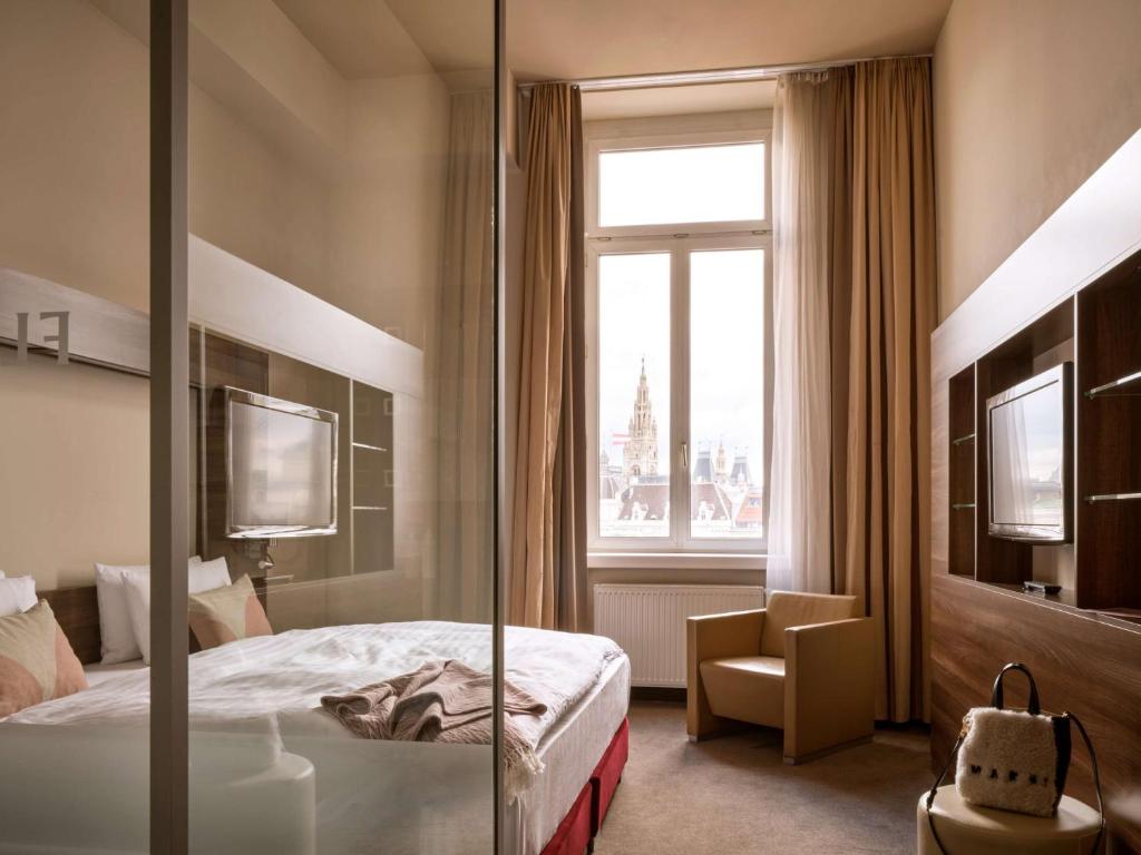 Postel nebo postele na pokoji v ubytování Flemings Selection Hotel Wien-City