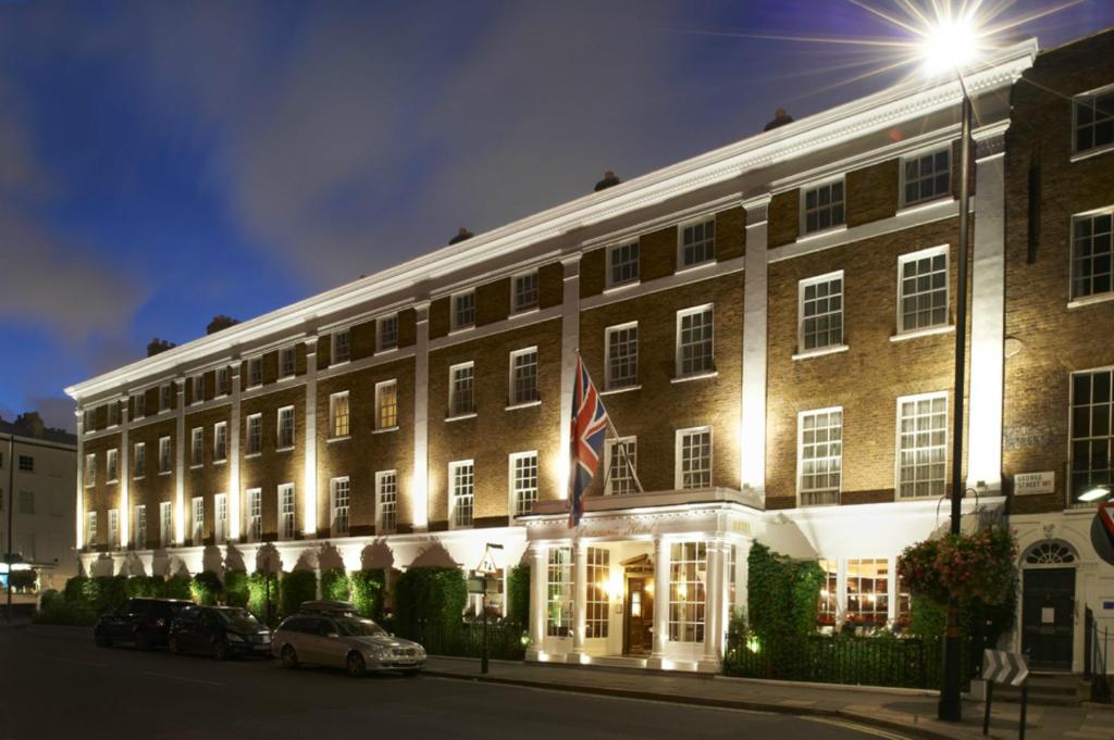 a large brick building with a flag in front of it at Durrants Hotel in London