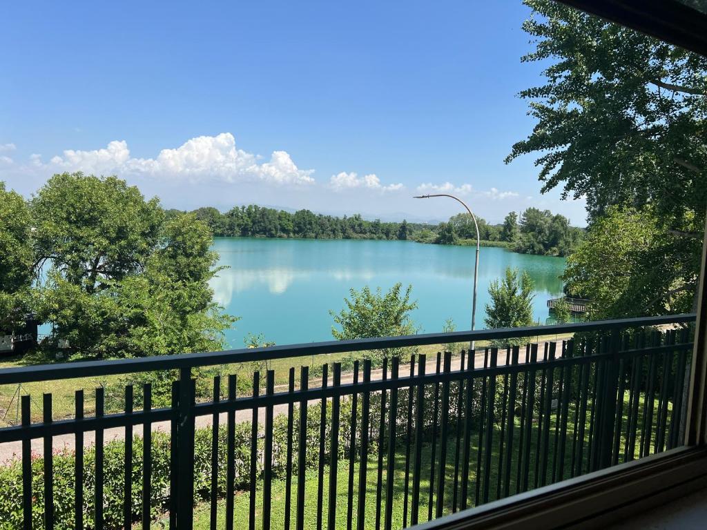 a view of a lake from a balcony at The little lake Verona villa in Bovo