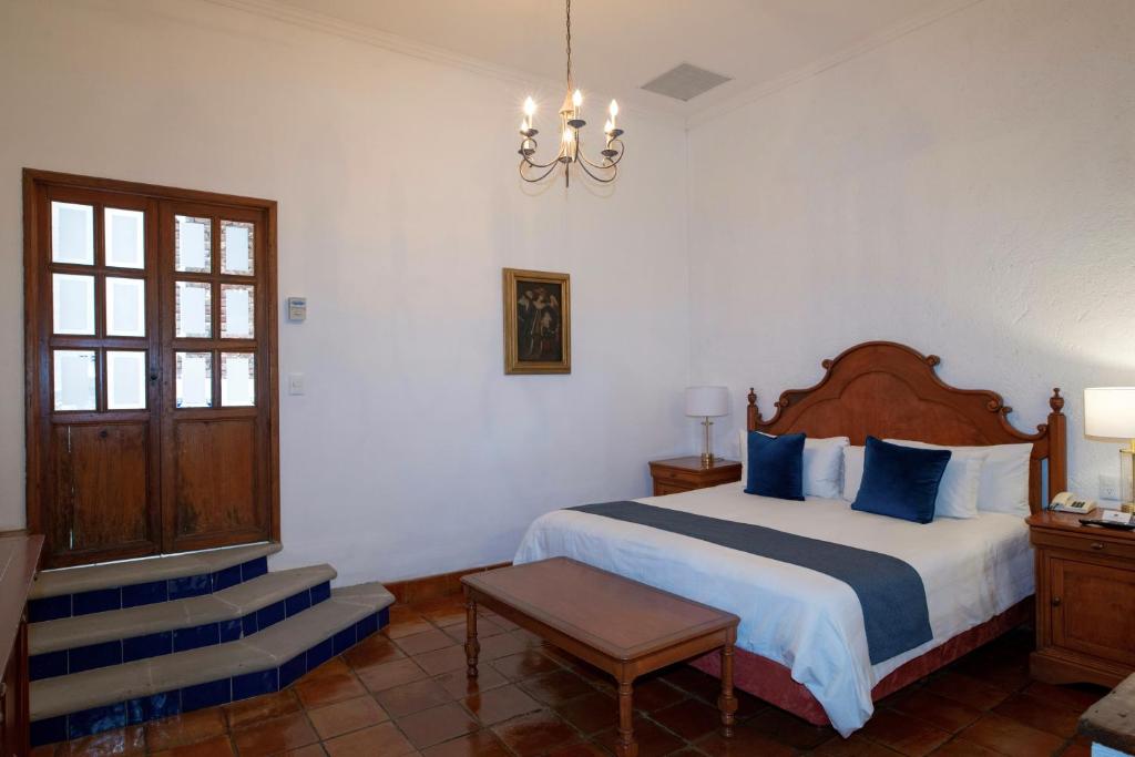Postel nebo postele na pokoji v ubytování Hotel Los Juaninos