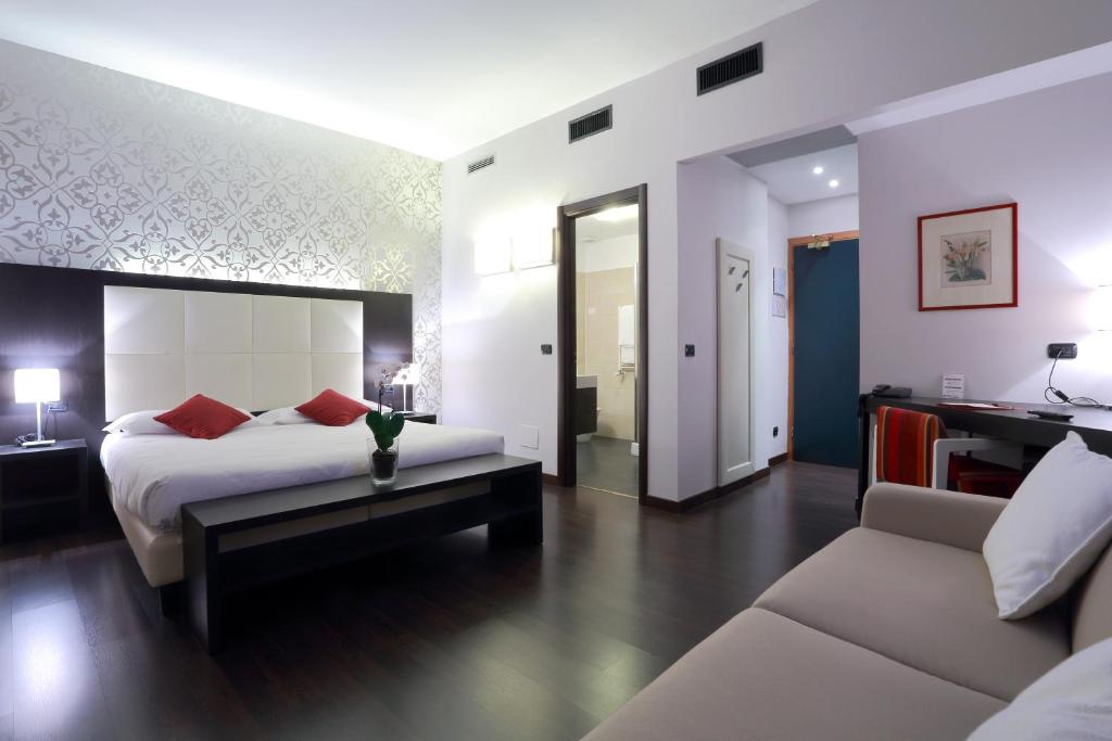 Postel nebo postele na pokoji v ubytování Hotel La Torretta