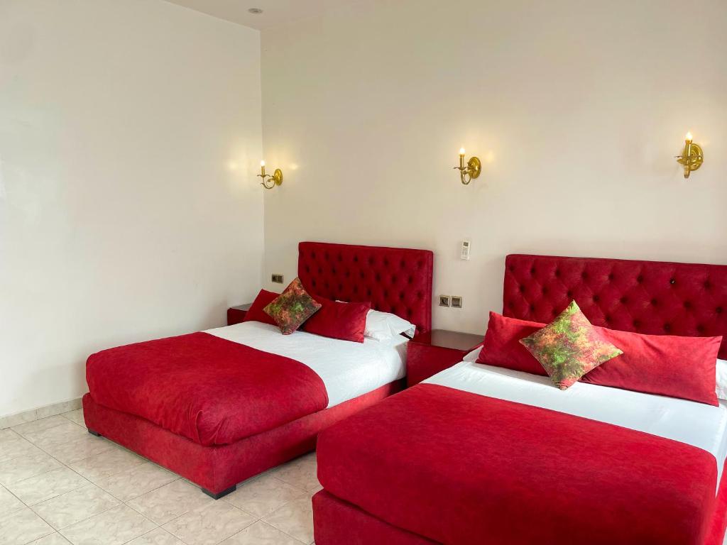 Ένα ή περισσότερα κρεβάτια σε δωμάτιο στο Hotel Palace tanger