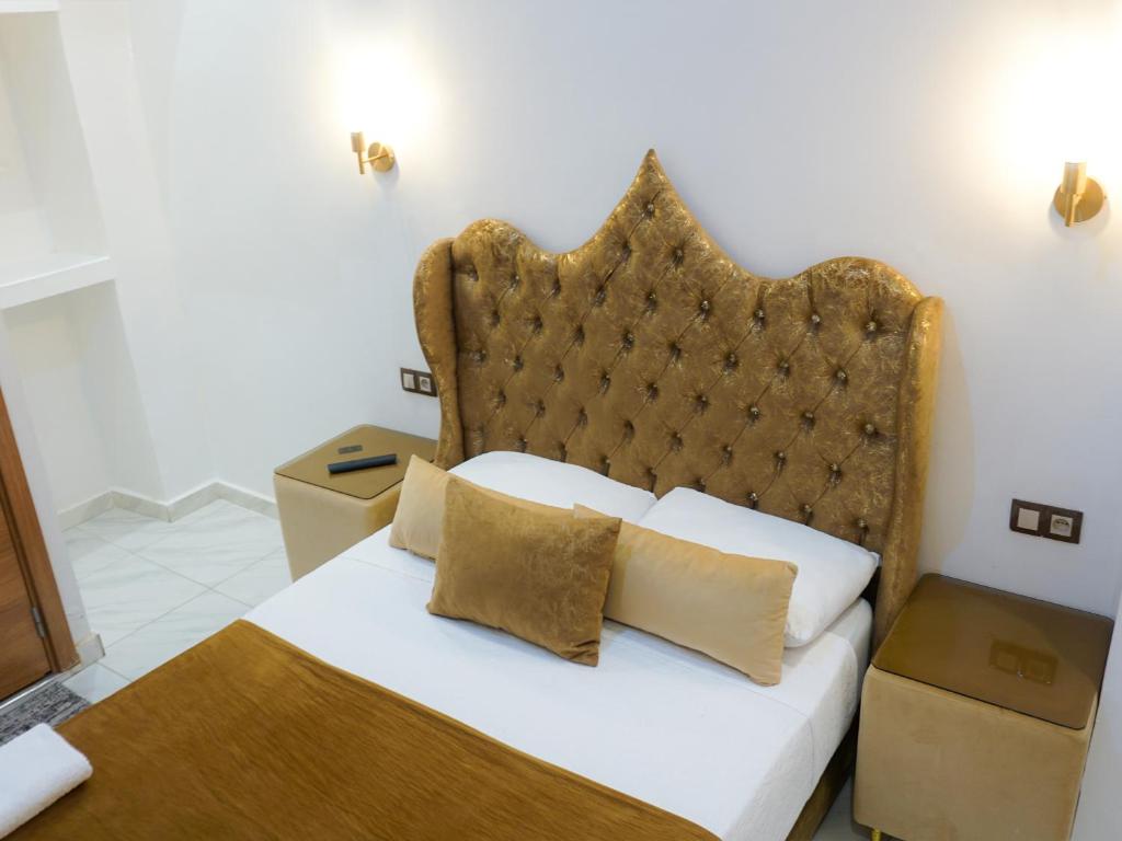 Ένα ή περισσότερα κρεβάτια σε δωμάτιο στο Hotel Palace tanger
