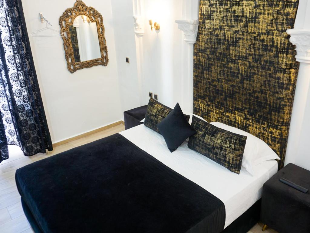 Ένα ή περισσότερα κρεβάτια σε δωμάτιο στο Hotel Palace tanger