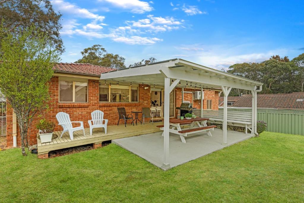 a pavilion on a deck in the yard of a house at Berry Haven by Experience Jervis Bay in Vincentia