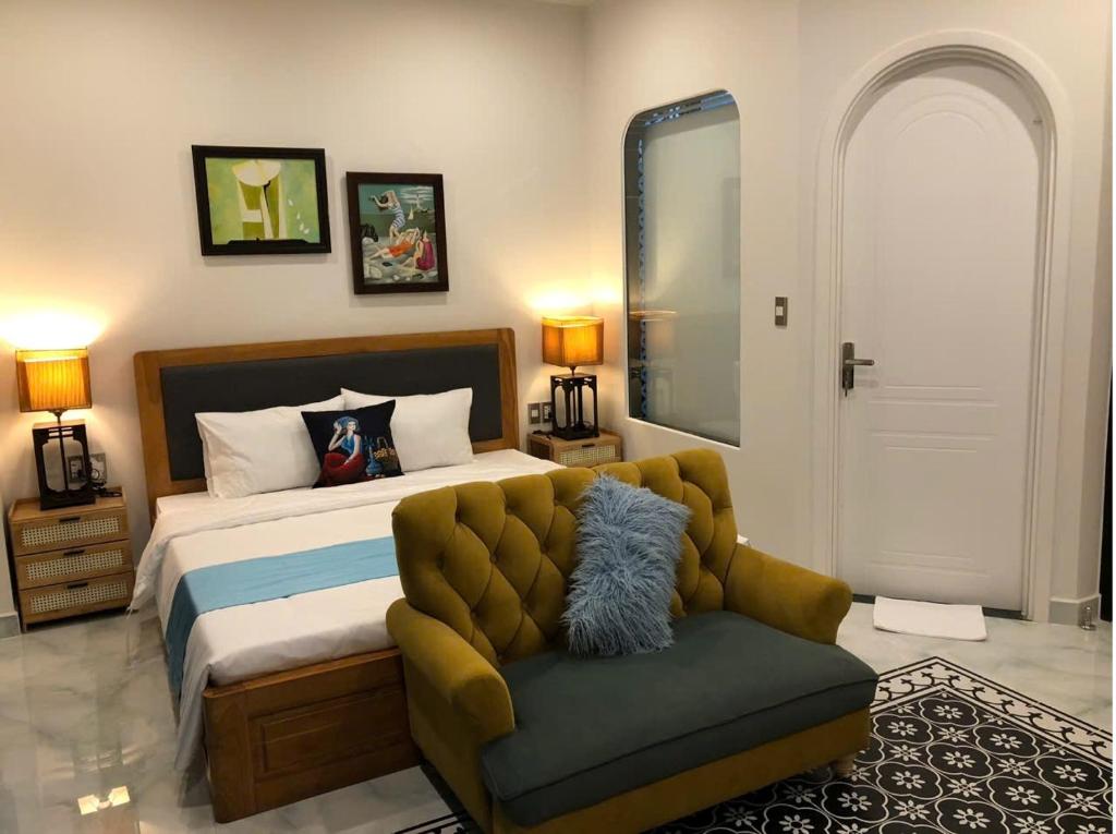 Postel nebo postele na pokoji v ubytování Longs Beach House - Wonderland Hồ Tràm