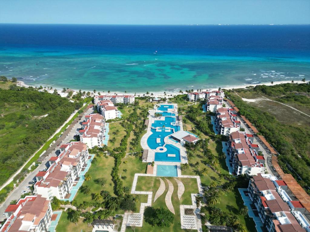 an aerial view of a beach with houses and the ocean at Mareazul Luxury ocean view penthouse and private beach club in Playa del Carmen