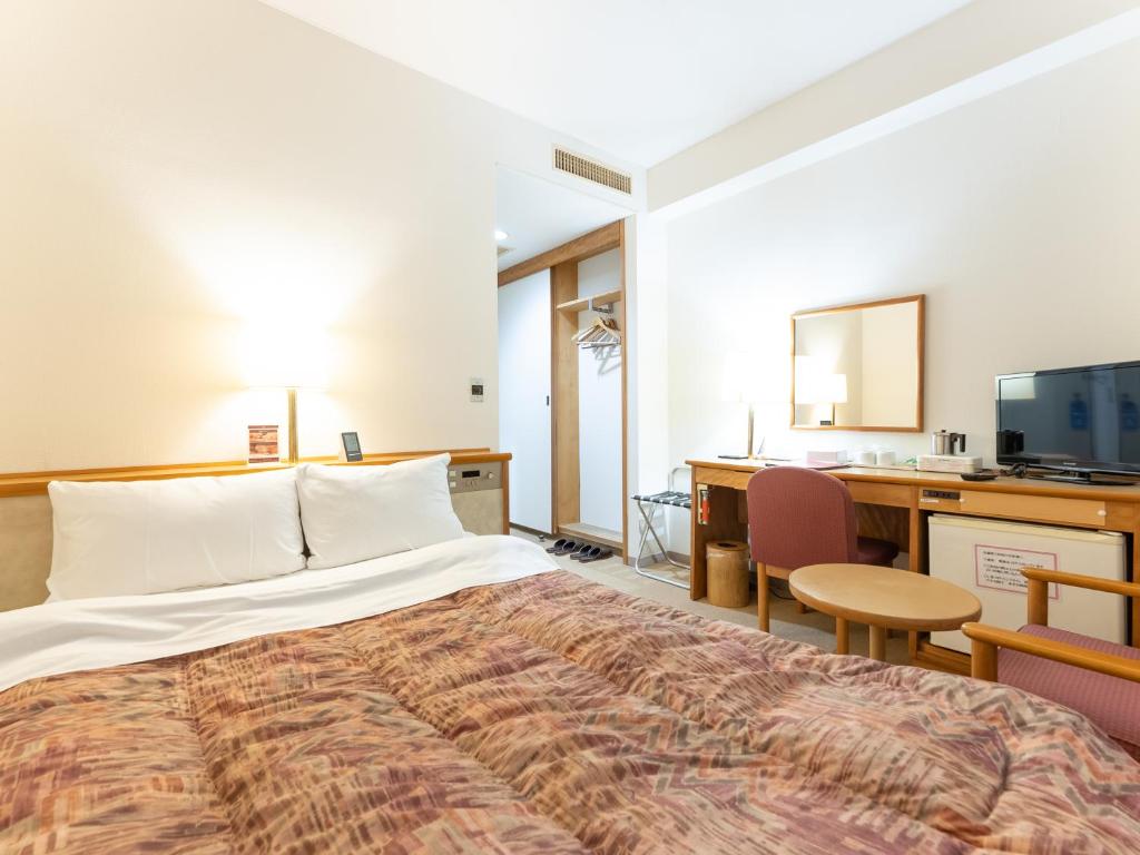 Postel nebo postele na pokoji v ubytování Tabist Hotel Mercury Asakusabashi
