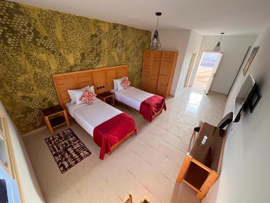 Postel nebo postele na pokoji v ubytování Fyndy Hotel Bir Gandouz
