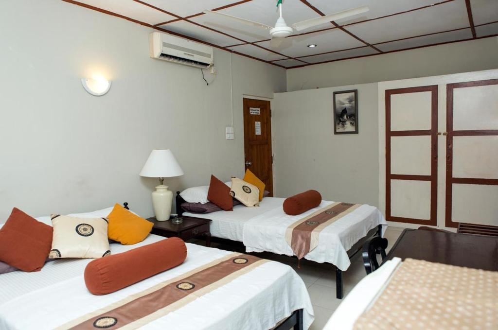 Postel nebo postele na pokoji v ubytování Ranveli Beach Hotel