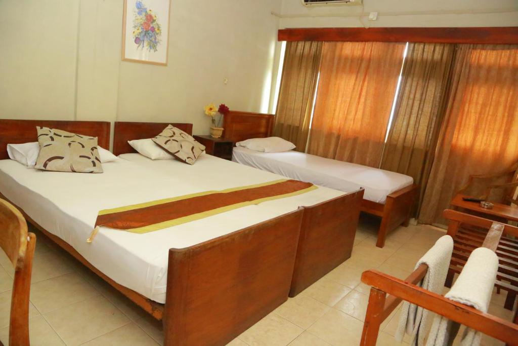 Postel nebo postele na pokoji v ubytování Ranveli Beach Hotel