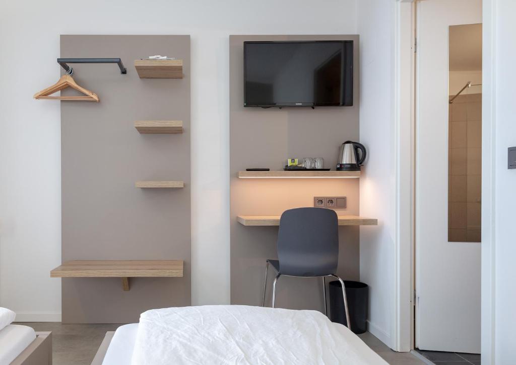 Postel nebo postele na pokoji v ubytování Hotel Lüneburg Süd
