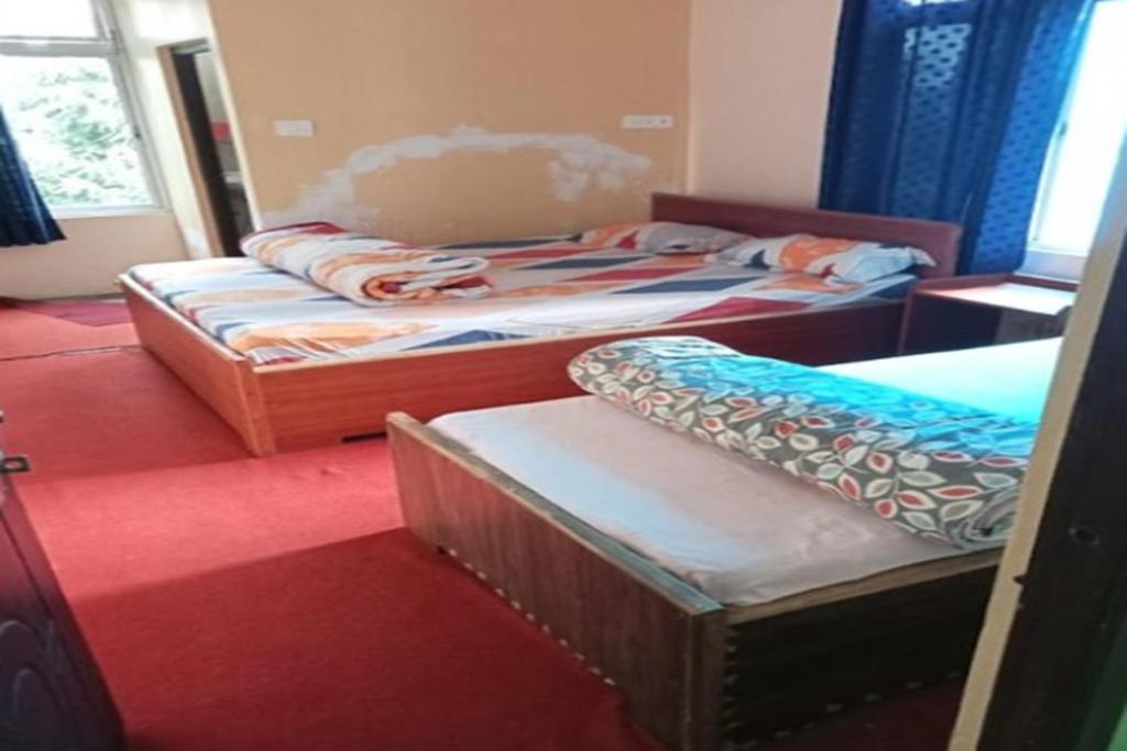 Postel nebo postele na pokoji v ubytování Green Wings Homestays by StayApart , Zoom , West Sikkim