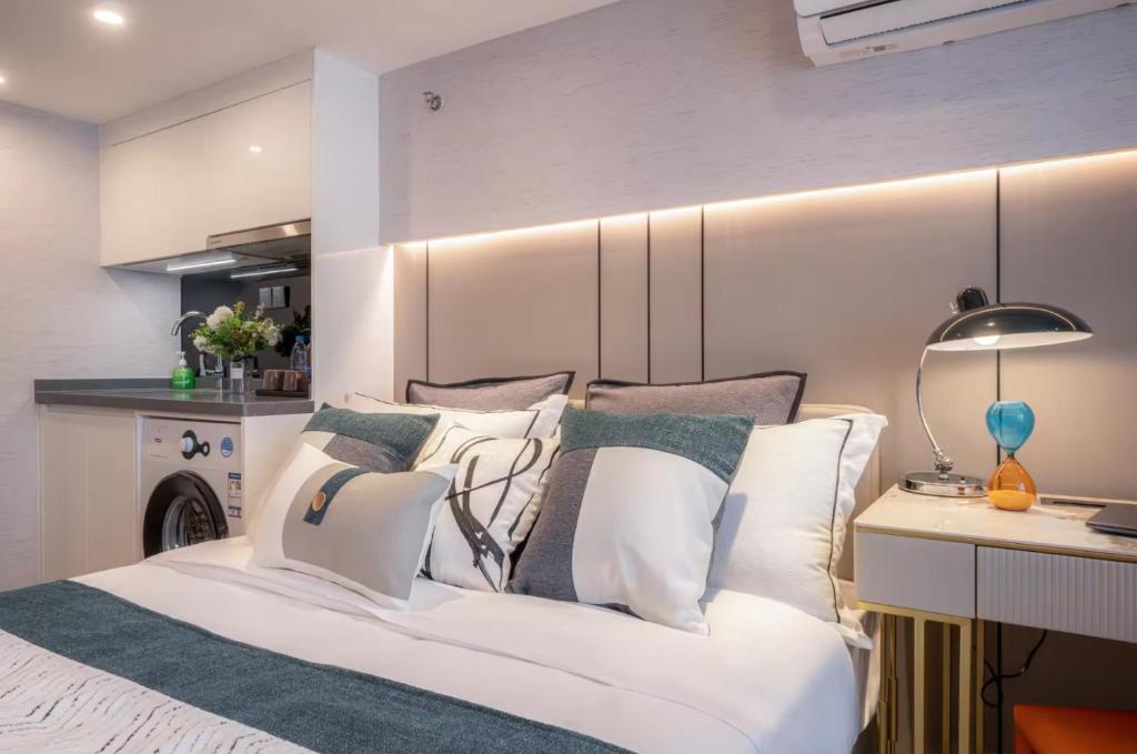 Postel nebo postele na pokoji v ubytování Yunbo Hotel