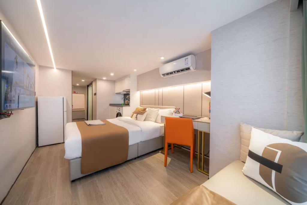 Postel nebo postele na pokoji v ubytování Yunbo Hotel