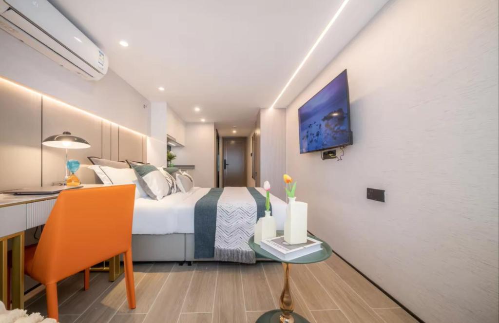 Postel nebo postele na pokoji v ubytování Yunbo Hotel