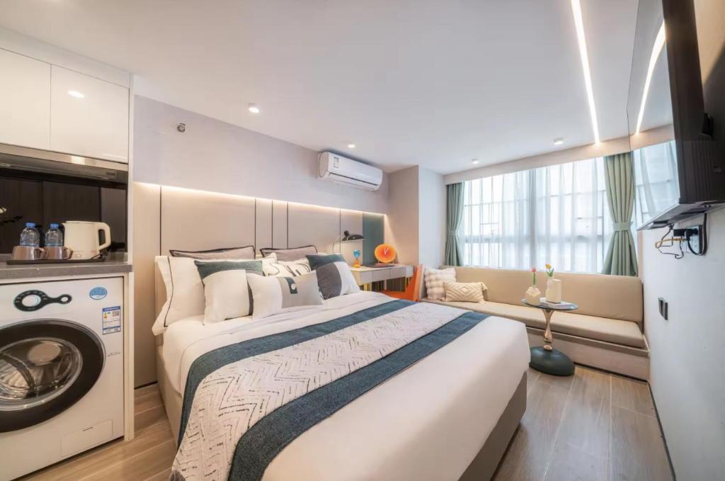 Postel nebo postele na pokoji v ubytování Yunbo Hotel