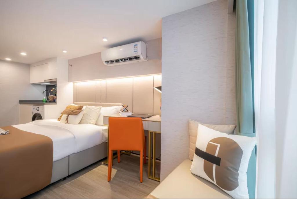 Postel nebo postele na pokoji v ubytování Yunbo Hotel